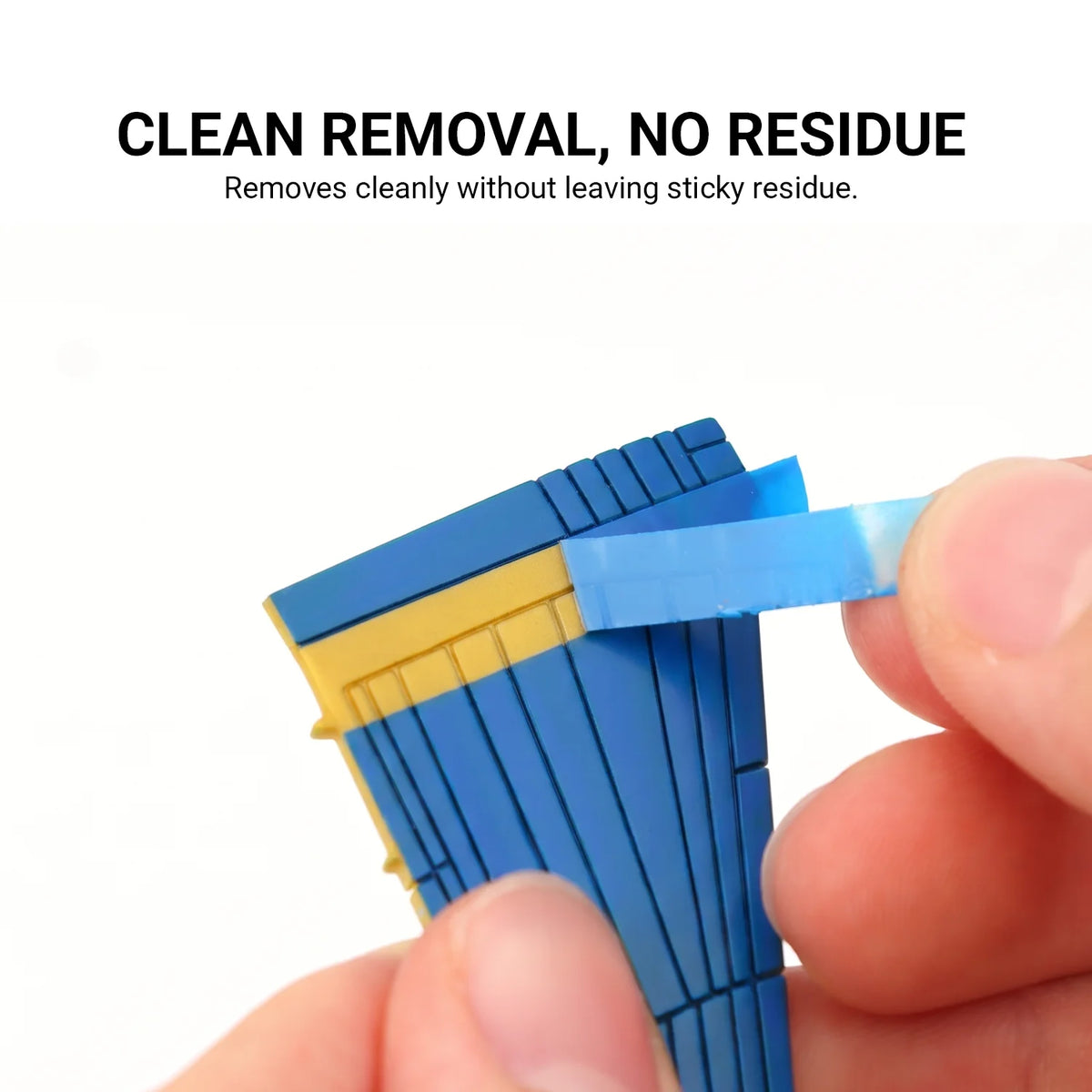 Blue fine line masking tape peeled from a painted blue and yellow model part