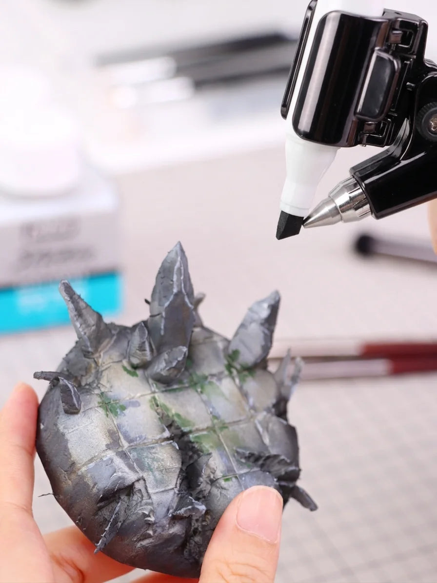 Using a cordless marker airbrush to shade a rocky scenic base