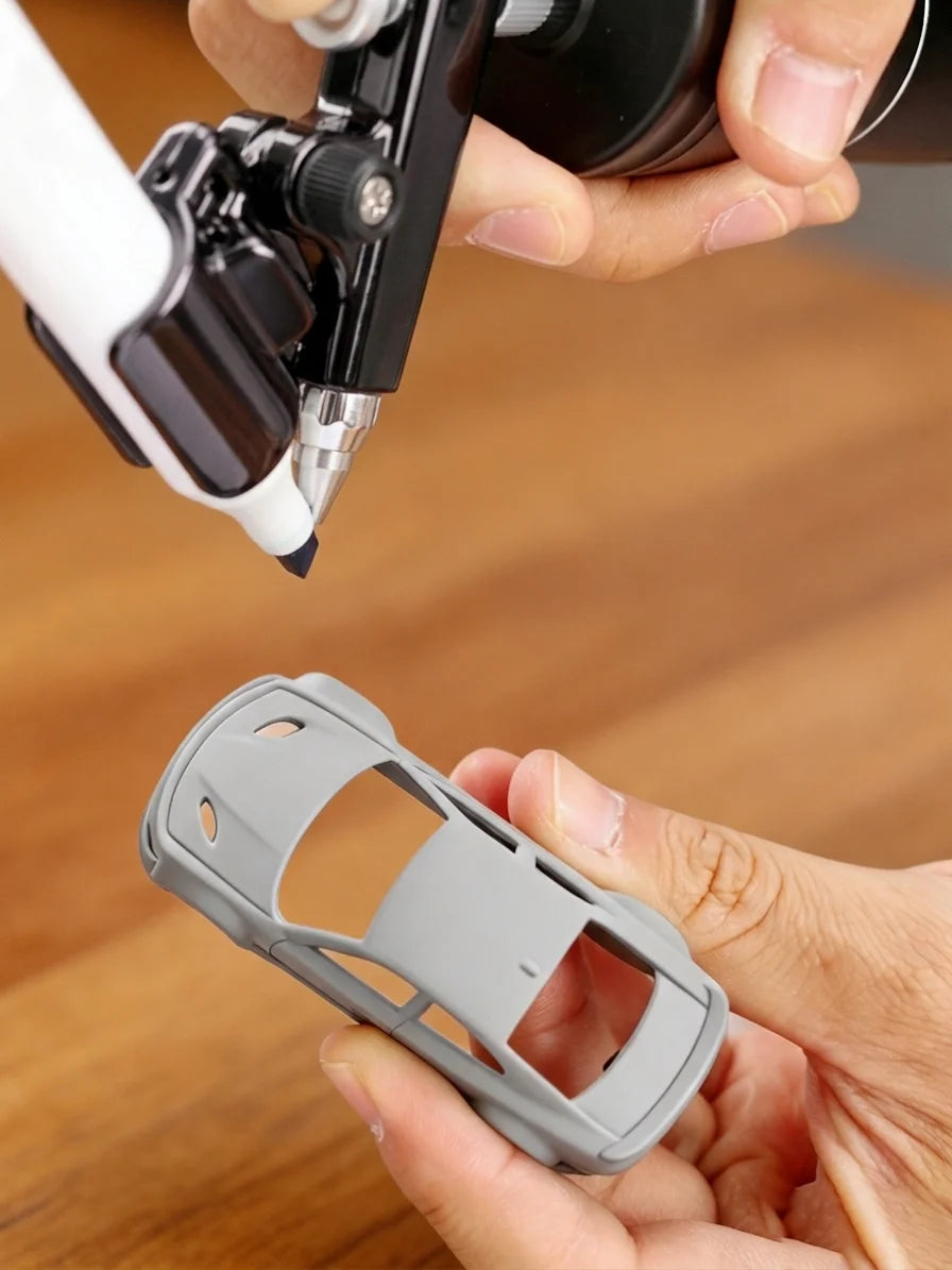 Using a cordless marker airbrush to shade a die-cast car body
