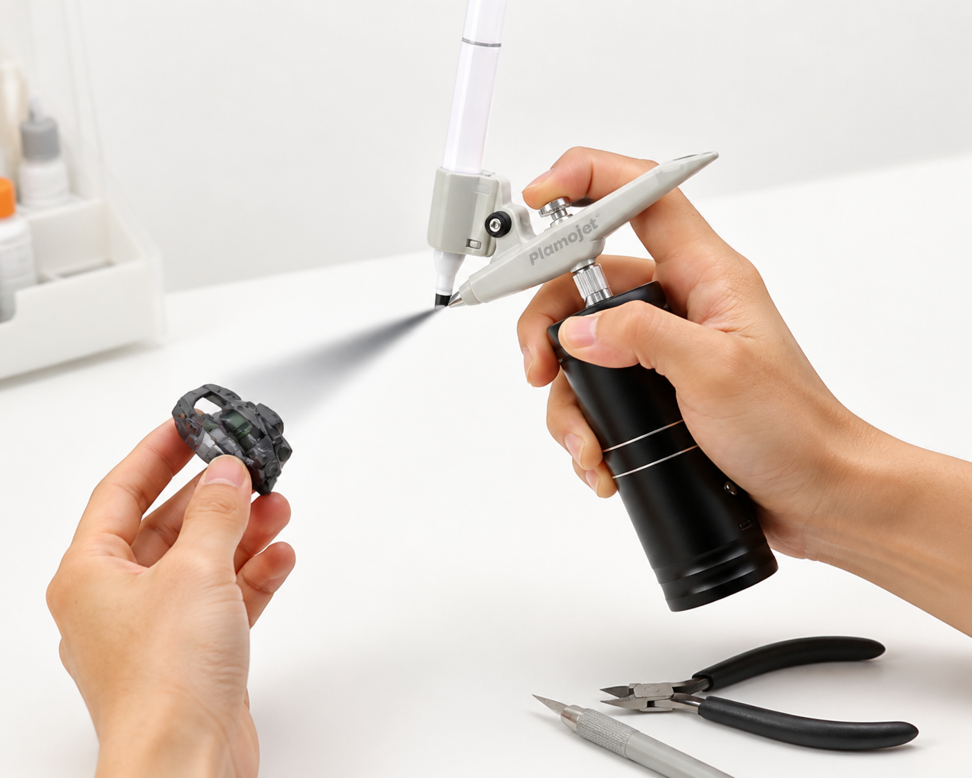 Plamojet customer testing a cordless marker airbrush concept